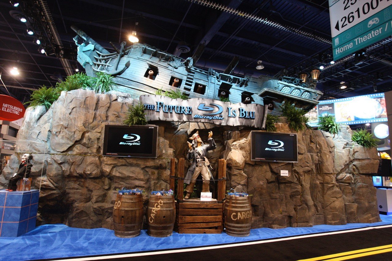 Blu-ray Disc Association booth at CES featuring a full-size pirate ship and the tagline The Future Is Blu